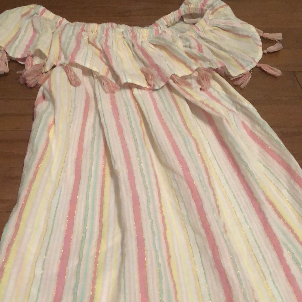 Adorable beach cover up with fringe on the top!